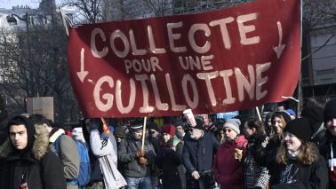 speech Protesters hold a banner reading ''Fund-raising for a guillotine'