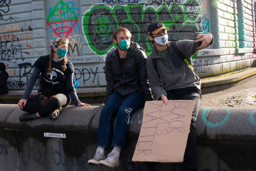 revolt Friends take a selfie in the the Capitol Hill Autonomous Zone (CHAZ) in Seattle, Washington