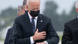 grief President Joe Biden looks down at his watch (Getty Images)