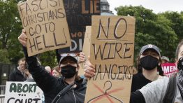 Marchers hold up signs during a Mothers Day rally in support of Abortion (Photo by Jemal Countess/Getty Images for Supermajority)
