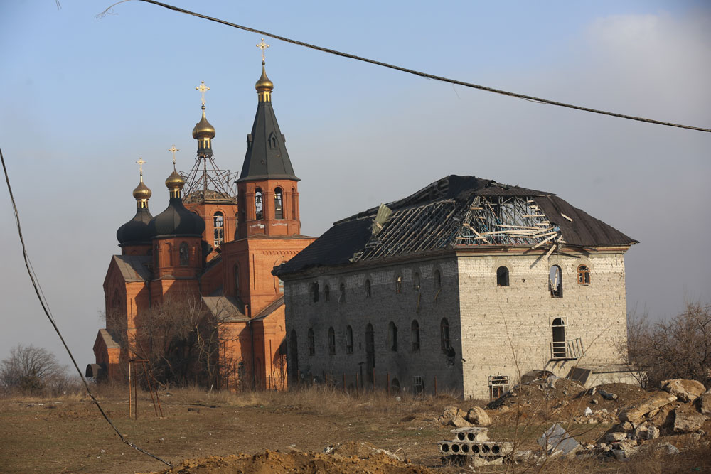 Damaged church and a buildings in the Ukrainian city of Mariupol