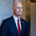 Sen. Rick Scott (R-FL) departs the Senate floor (Getty Images)