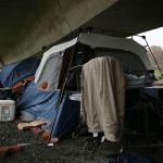 Tents are seen underneath an overpass at a tent encampment in Washington, DC. (Photo by Alex Wong/Getty Images)
