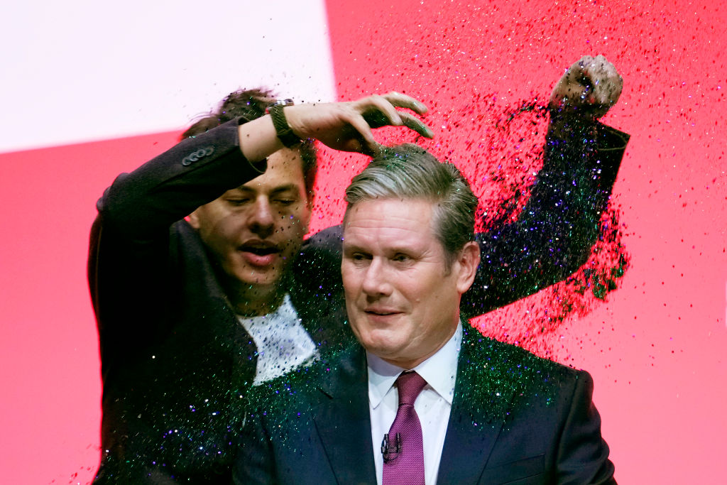 Watch: protestor throws glitter on Starmer during speech | The Spectator