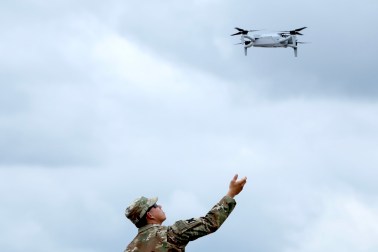 ARLINGTON, VA - JUNE 14: A soldier prepares to catch a drone in the Pentagon parking lot on June 14, 2025 in Arlington, Virginia. The U.S. Army is marking its 250th anniversary with a military parade along Constitution Avenue that includes roughly 6,600 troops, 150 vehicles, and over 50 aircraft. The parade, which coincides with President Donald Trump's 79th birthday, is designed to tell the history of the Army. (Photo by Samuel Corum/Getty Images)