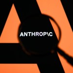 The Anthropic logo is displayed on a computer screen photographed through a magnifying glass in Creteil, France, on April 21, 2026. The image is taken amid reports of the NSA using Claude Mythos Preview despite a ban on Anthropic for United States government agencies. (Photo by Samuel Boivin/NurPhoto via Getty Images)